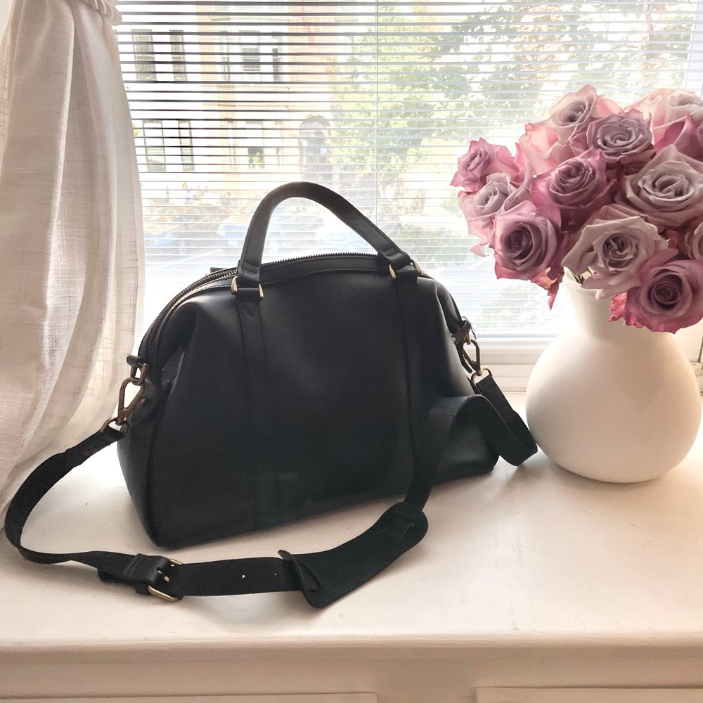 Black Madewell handbag with a top handle as well as a crossbody strap